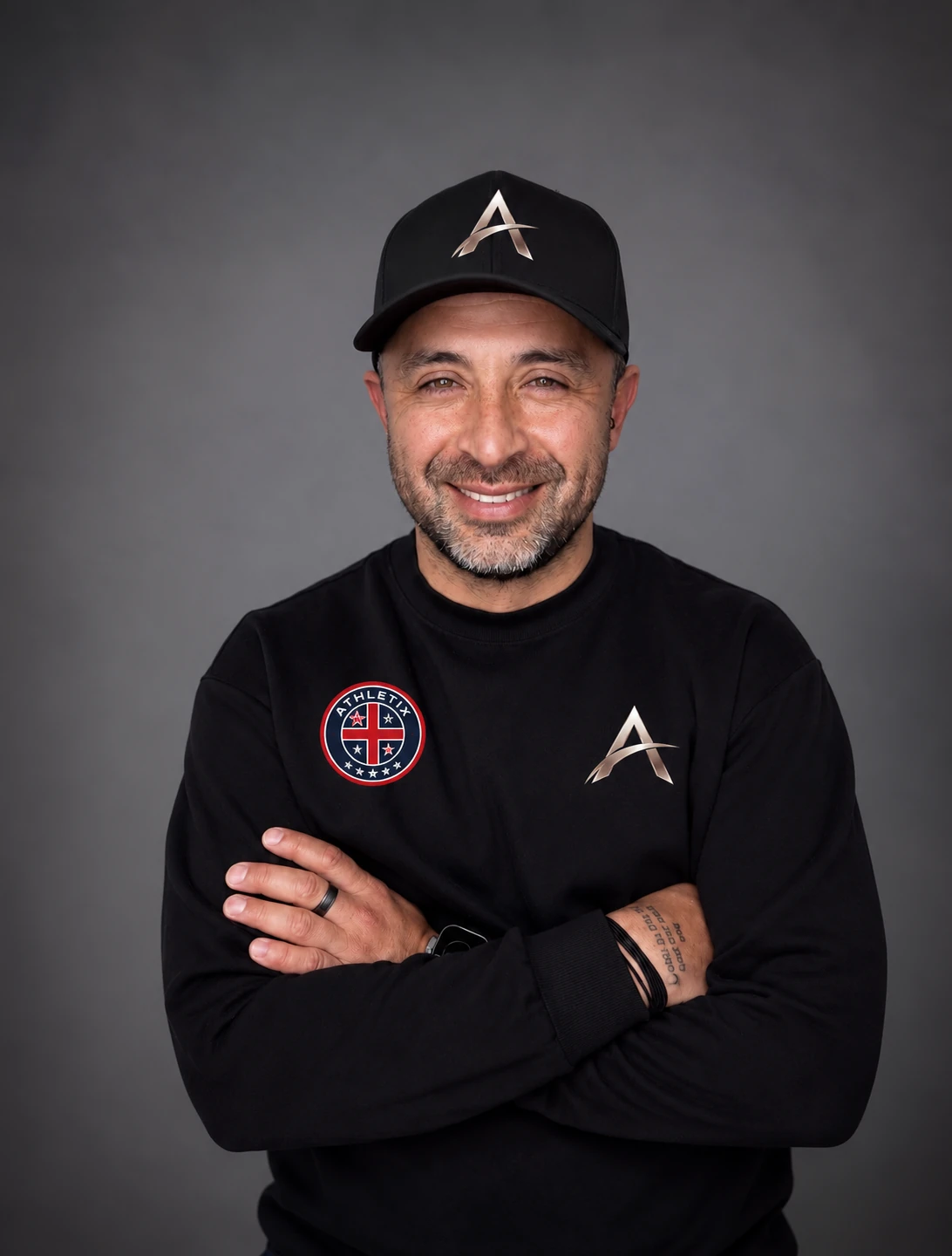 Coach Julio in his ATHLETIX cap and sweatshirt